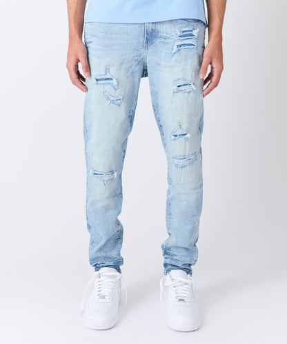 Rip And Repair Light Wash Denim Jeans
