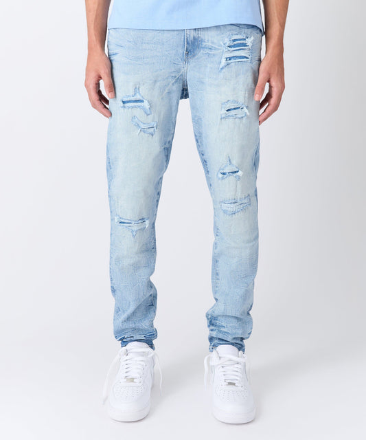 Rip And Repair Light Wash Denim Jeans
