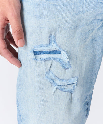 Rip And Repair Light Wash Denim Jeans